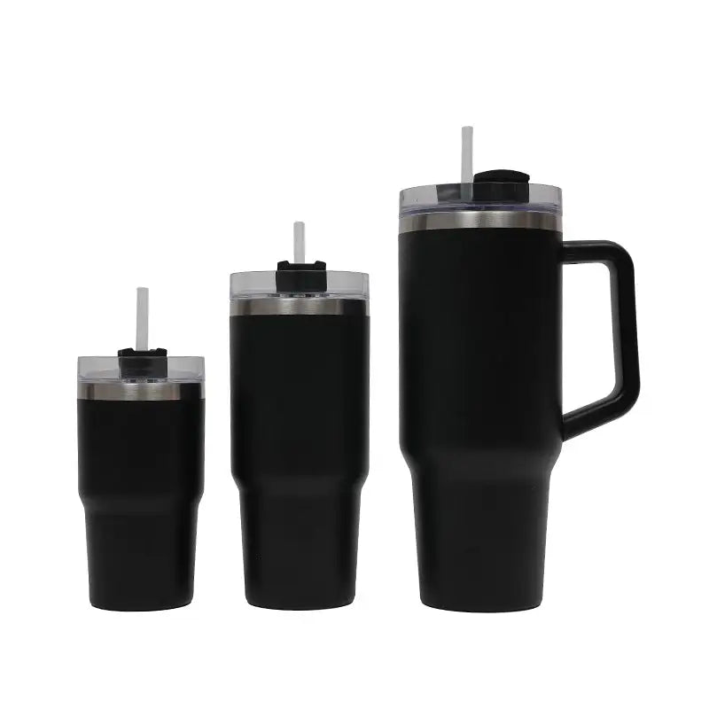 Set of black insulated tumblers with handles and straws on a white background