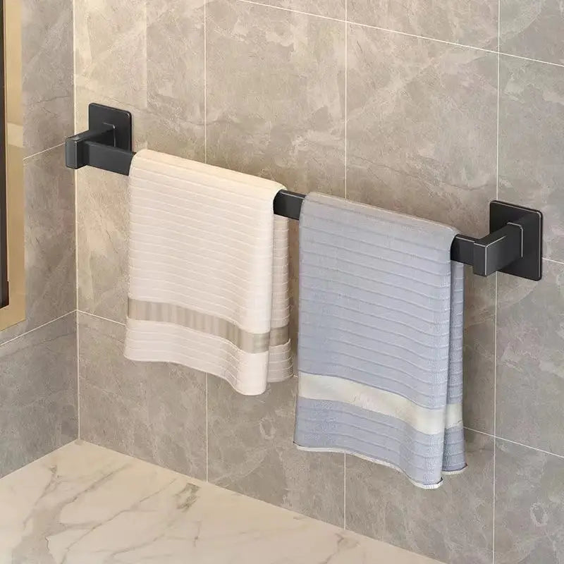Black towel rack with towels.