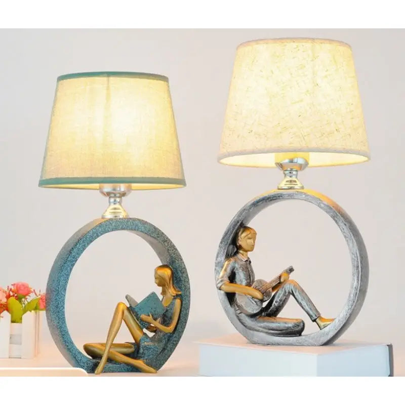 Two decorative lamps with circular bases.