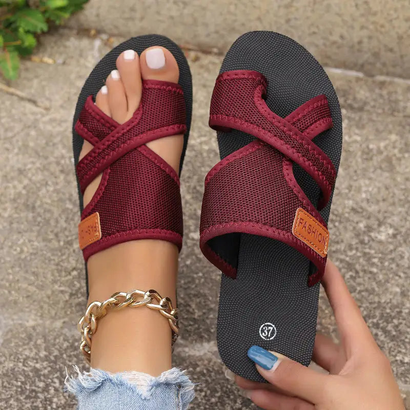 Burgundy criss-cross toe sandals.