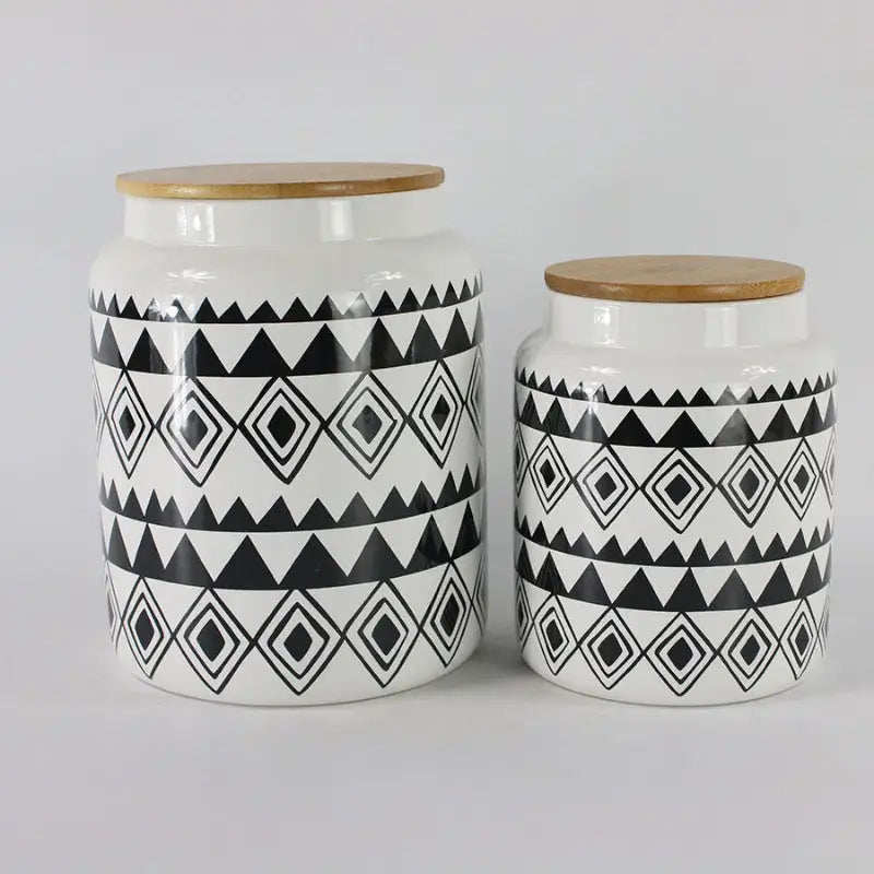 White ceramic storage canister with geometric patterns for kitchen organization