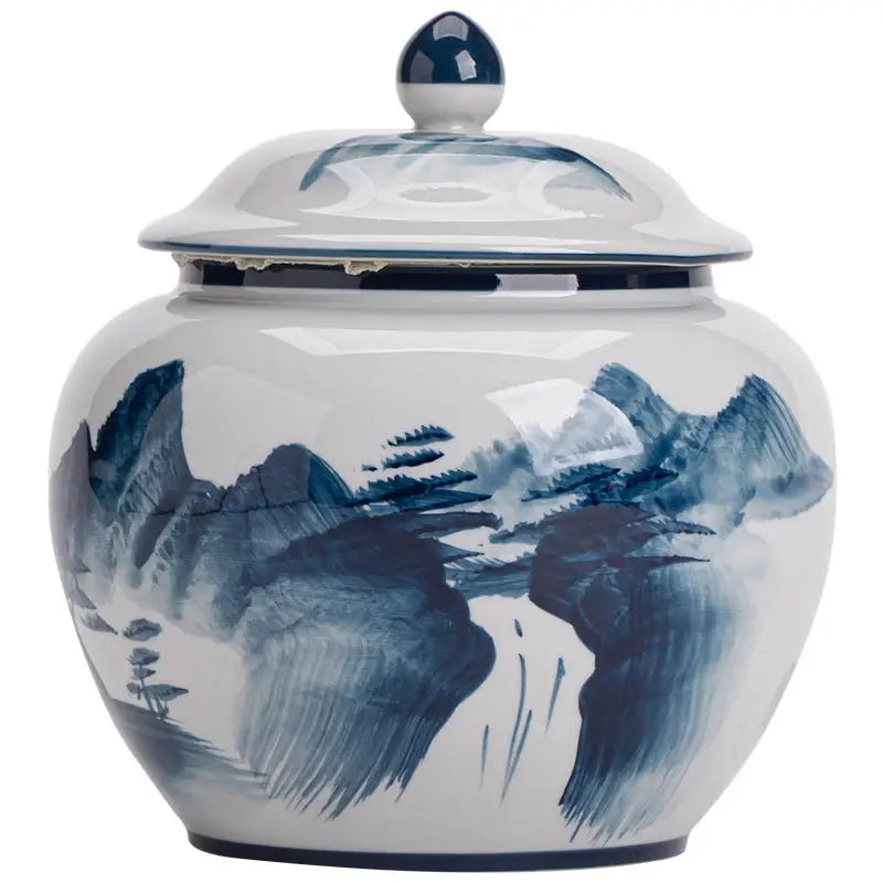 White ceramic ginger jar with blue landscape design as a stylish ceramic tea canister