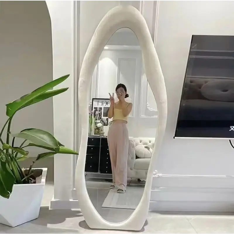 Full-length irregular white mirror.
