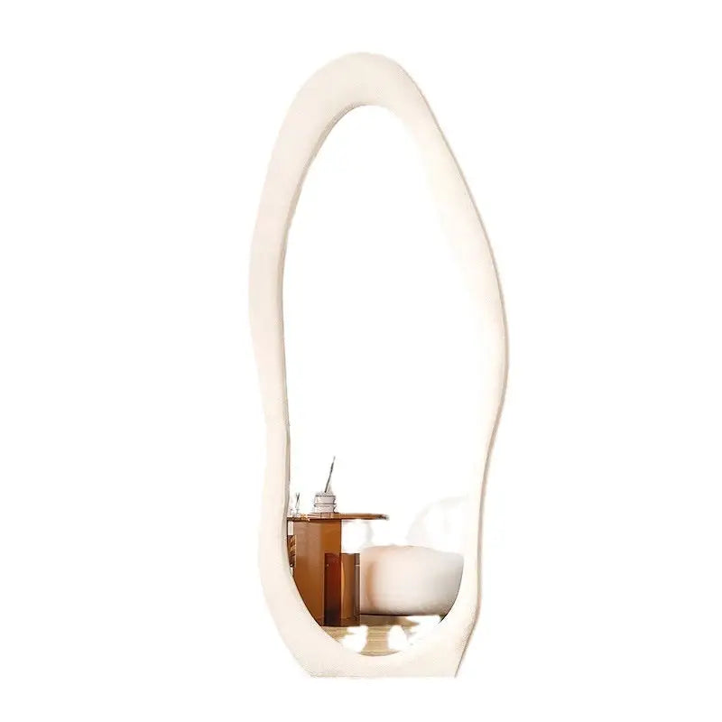 Irregularly shaped white-framed mirror.