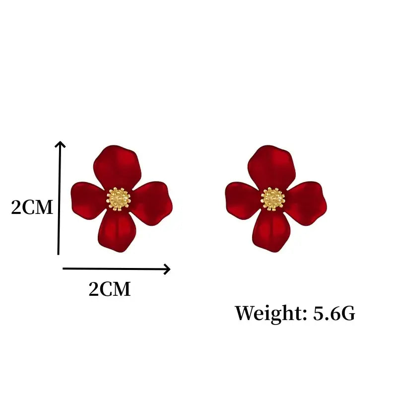 Red flower earrings with gold centers.