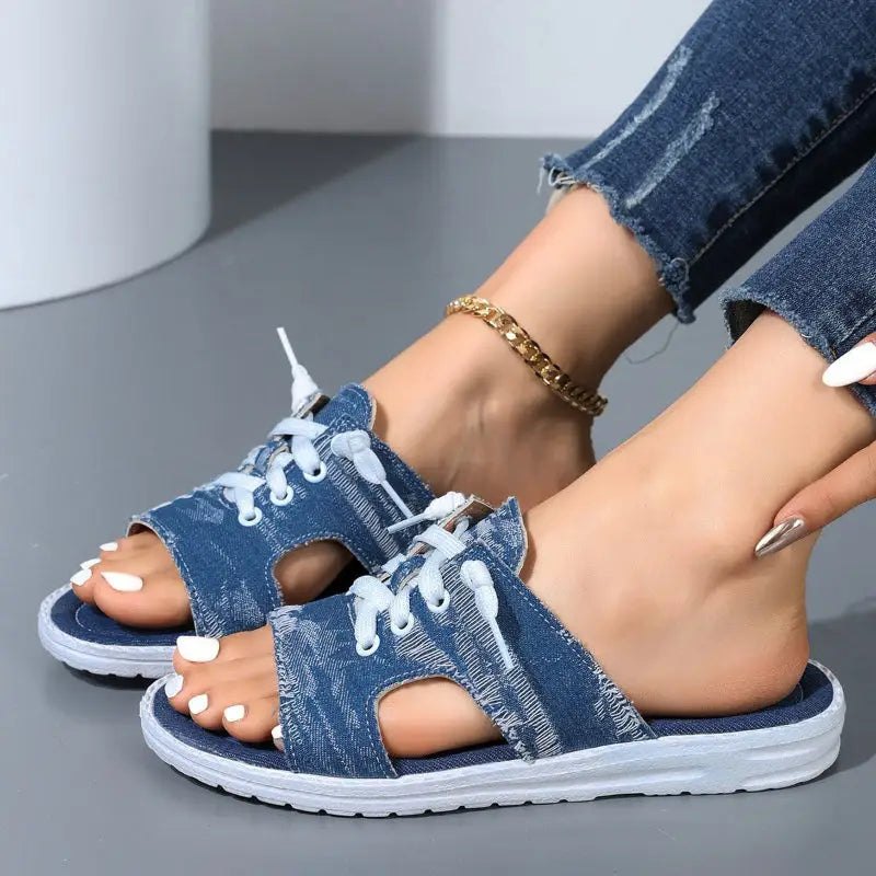 Denim slide sandals with laces.