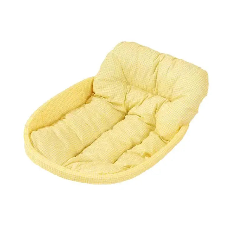Yellow padded pet bed.