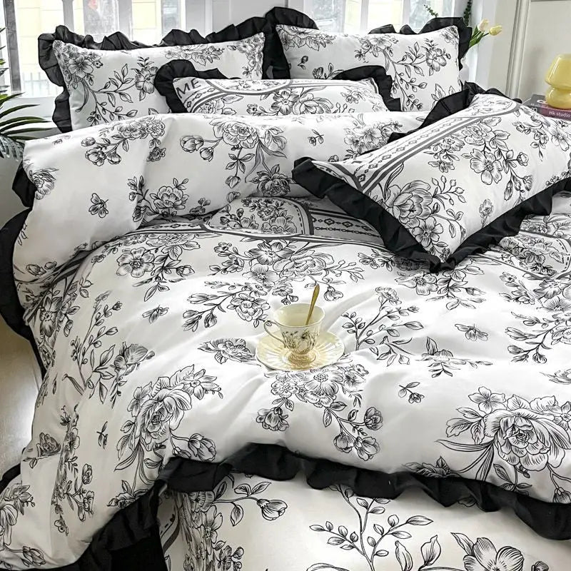 Floral patterned bedding set with ruffled trim.