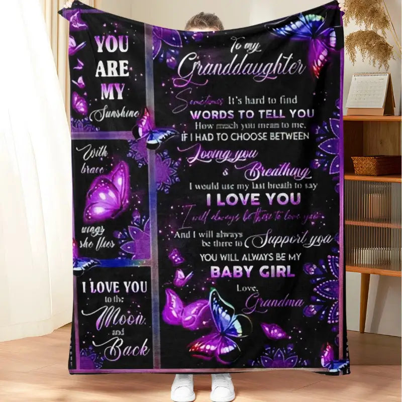 Purple butterfly themed blanket.