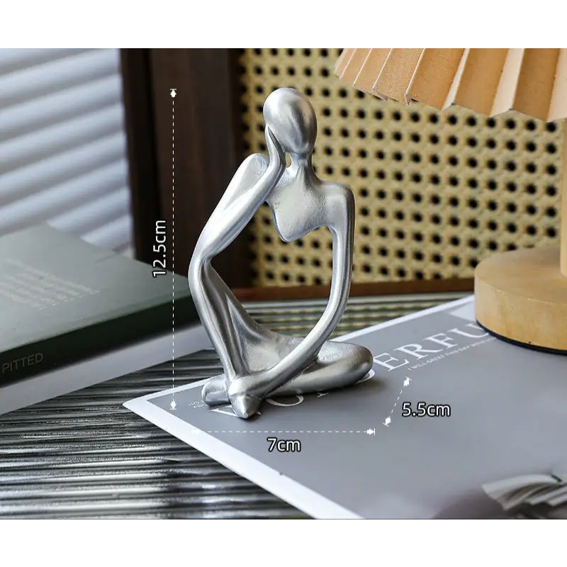 Silver abstract thinker sculpture.