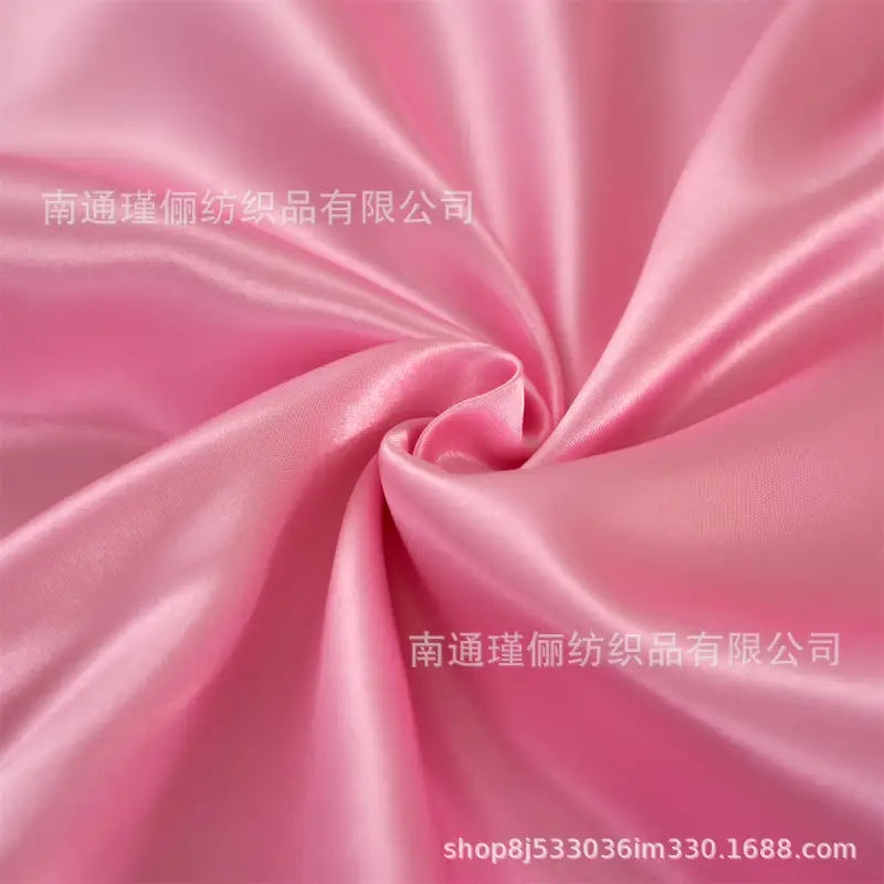 Swirled pink satin fabric.