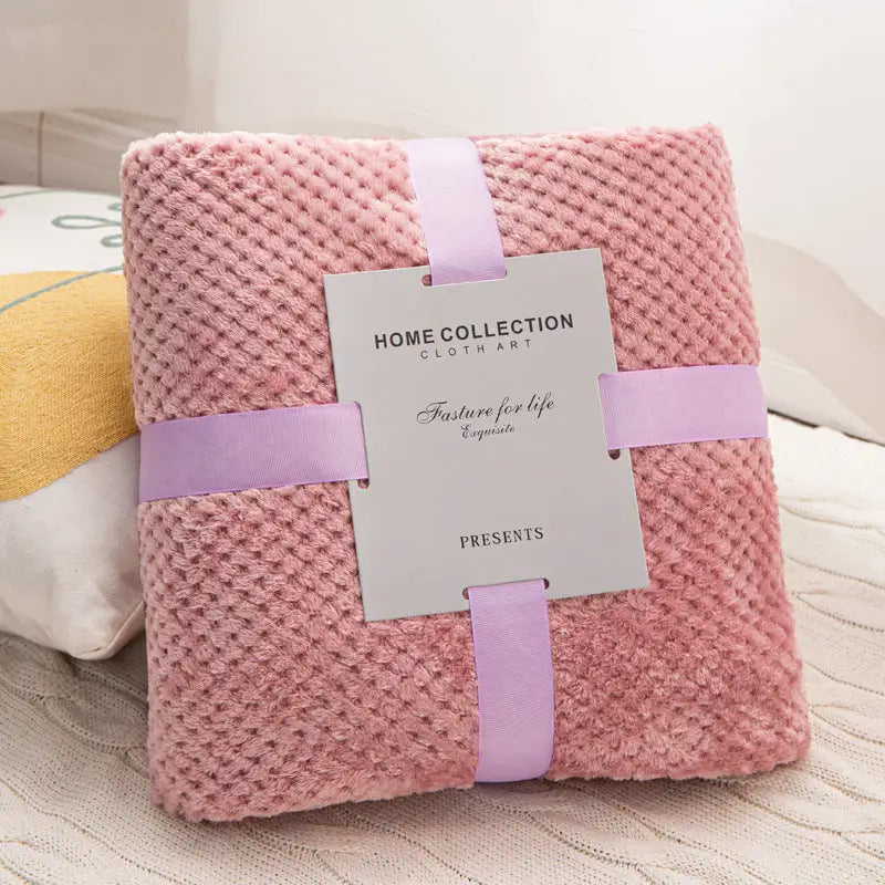 Pink textured plush blanket.