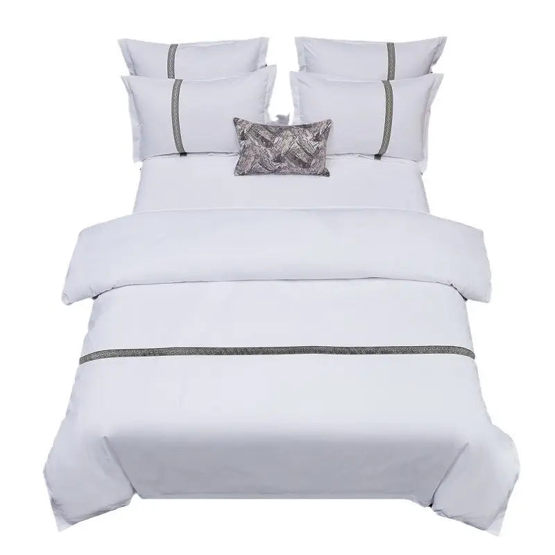 White bedding set with gray accents.