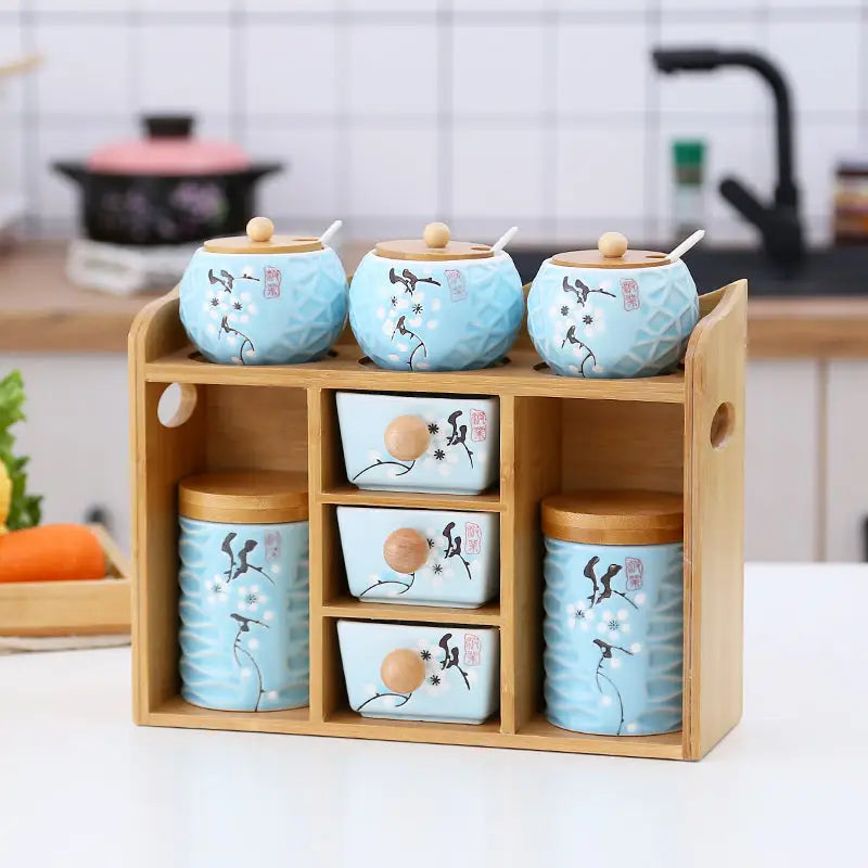 Wooden spice rack with blue glass seasoning boxes on salt sugar glass shelf