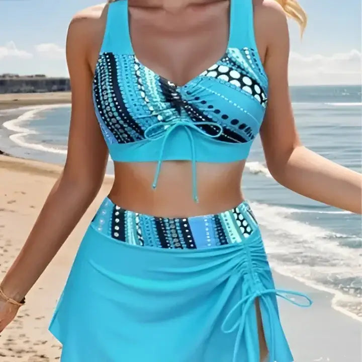 Blue patterned swimsuit with skirt.