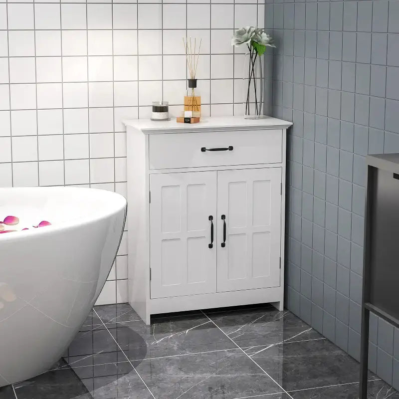 White bathroom cabinet with drawer.