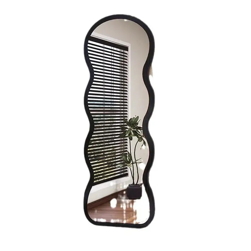 Wavy-edged black-framed mirror.