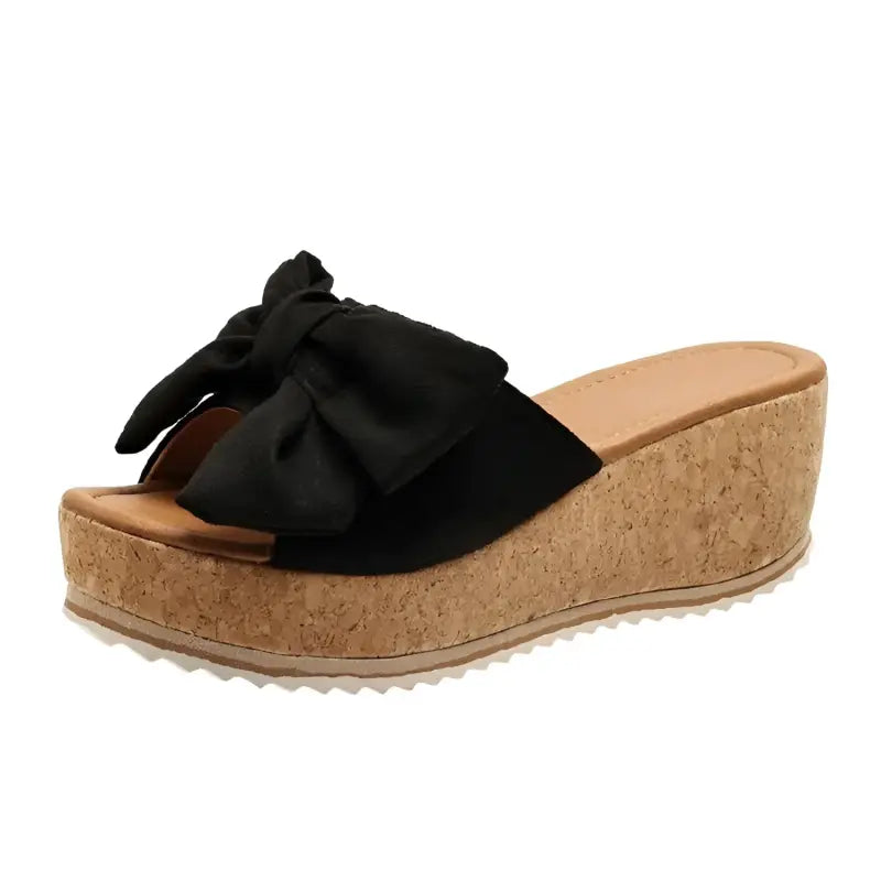 Black bow wedge sandal.