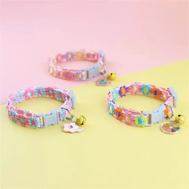 Floral cat collars with bells.