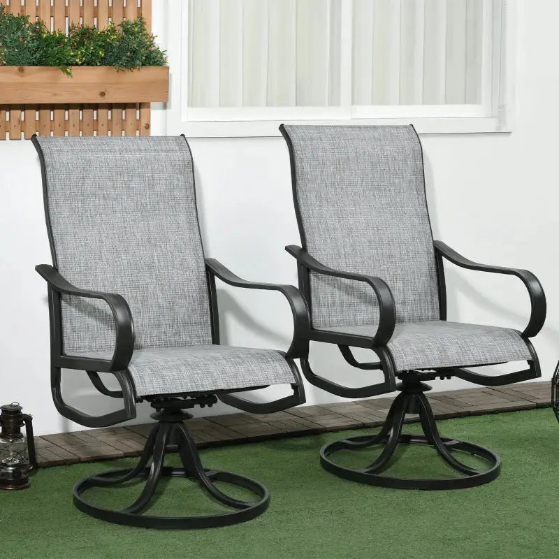 Two gray swivel patio chairs.