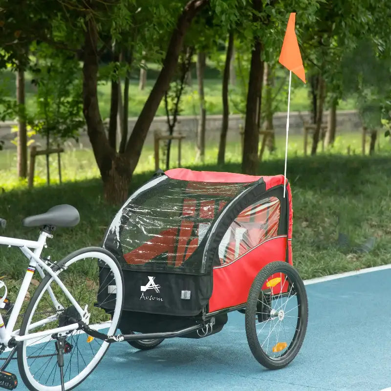 Red and black bicycle trailer.