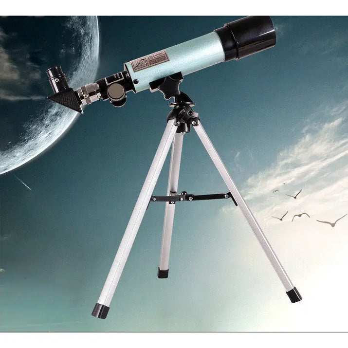 Telescope on a tripod with a celestial background