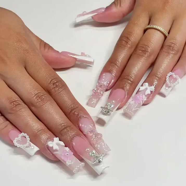 Elaborate, decorated fingernails.