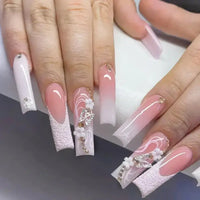 Elaborate, decorated fingernails.