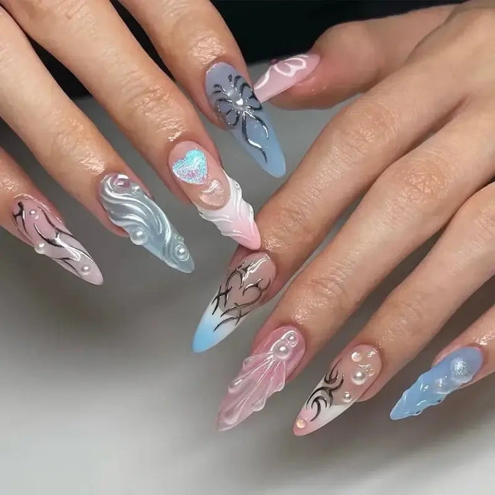 Elaborate, stiletto-shaped nail art.