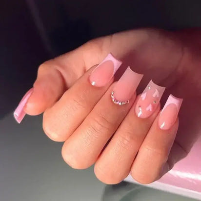 Pink and white manicured nails.