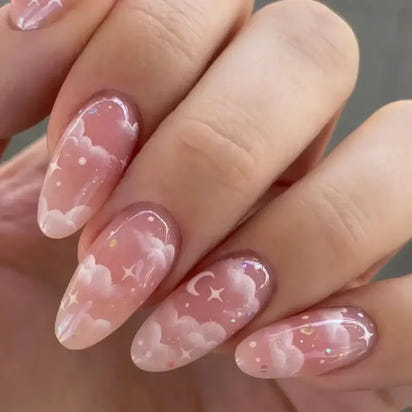Almond-shaped nails with cloud and star art.