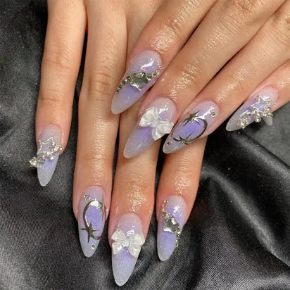 Decorated lavender stiletto nails.