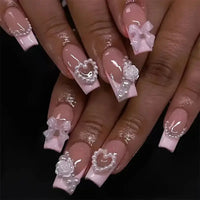 Elegant pearl-adorned nail art.