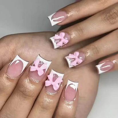 Elegant pink and white floral nail art.