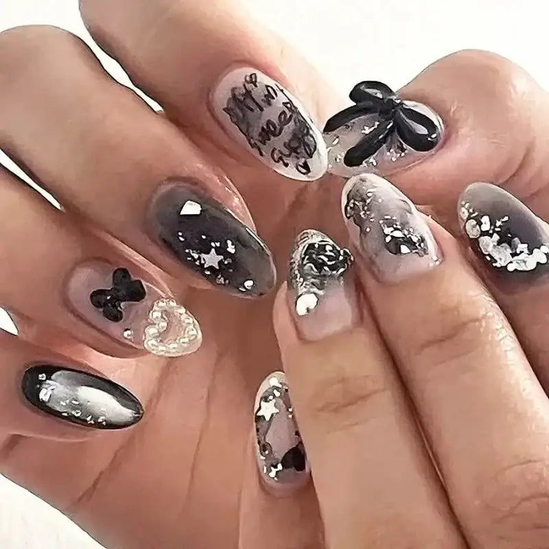 Elaborate black and silver nail art.