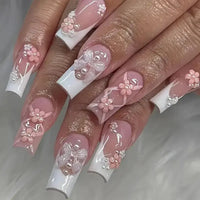 Elaborate, decorated fingernails.