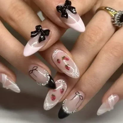 Decorated almond-shaped nails.