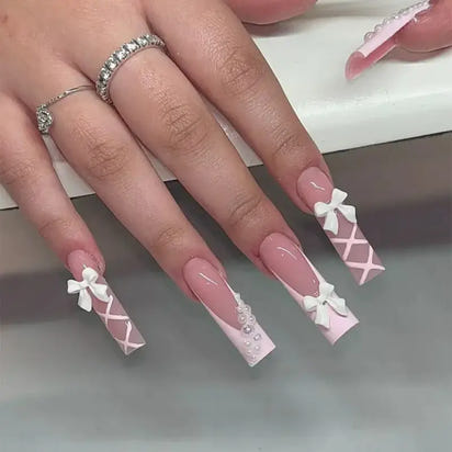Elegant, long, decorated nails.
