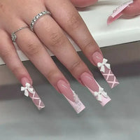 Elegant, long, decorated nails.