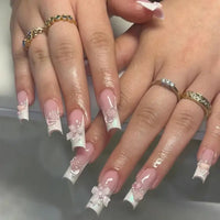 Elaborate, floral-accented French manicure.