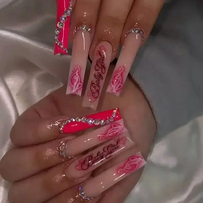 Elaborate, pink-themed nail art.