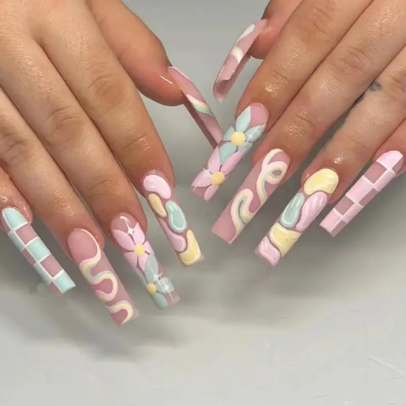 Pastel-colored, long, decorated nails.