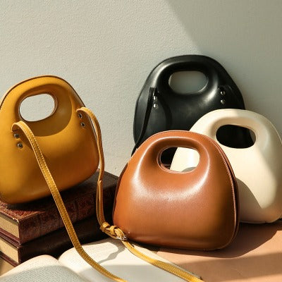 Discover the Shell Round Flap Handbag, a lightweight and stylish choice for parties and outdoor activities. Available in vibrant colors and unique shapes.