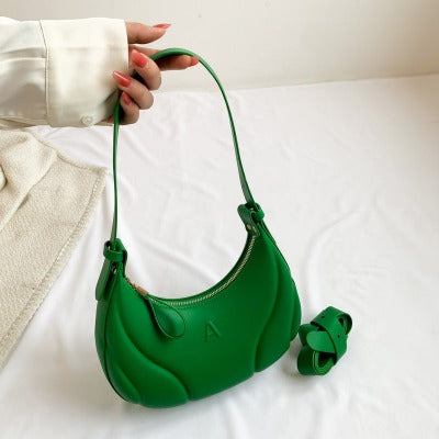 green creasent shape bag