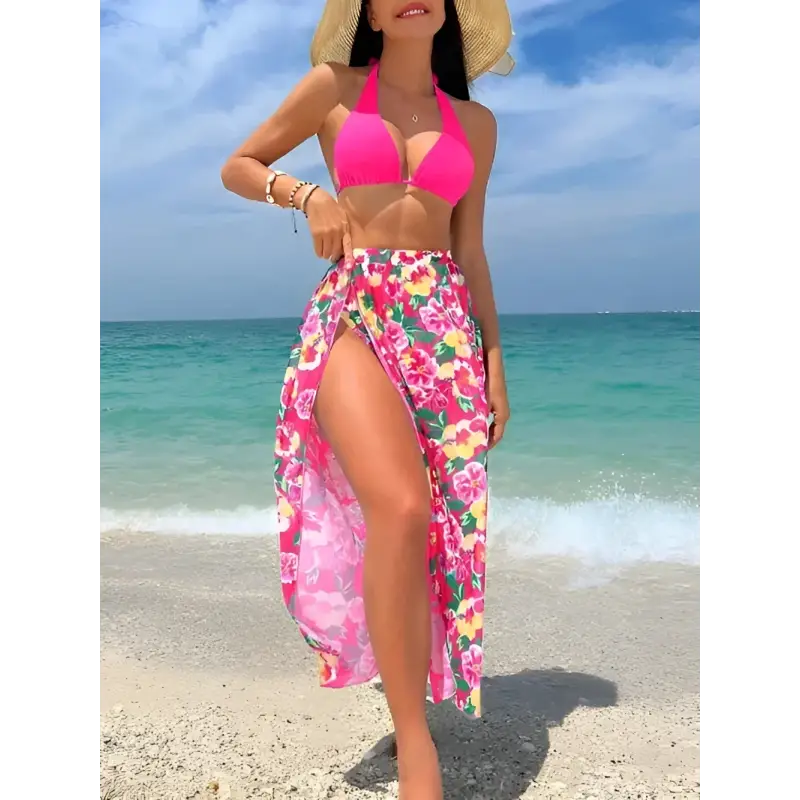 Woman in pink bikini and floral sarong.