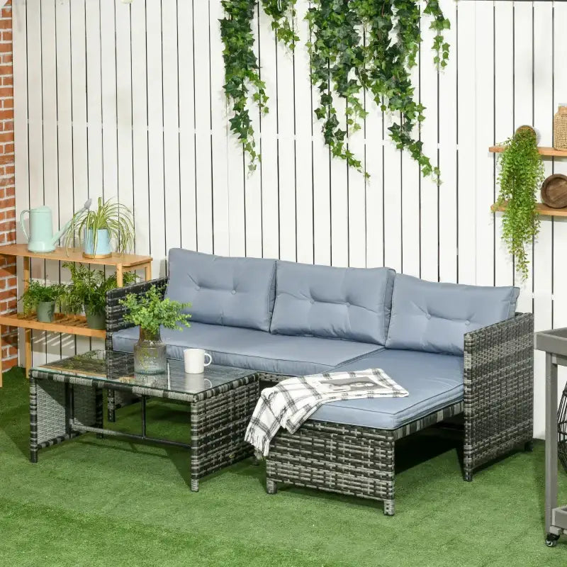 Wicker outdoor sectional sofa with glass-topped table.