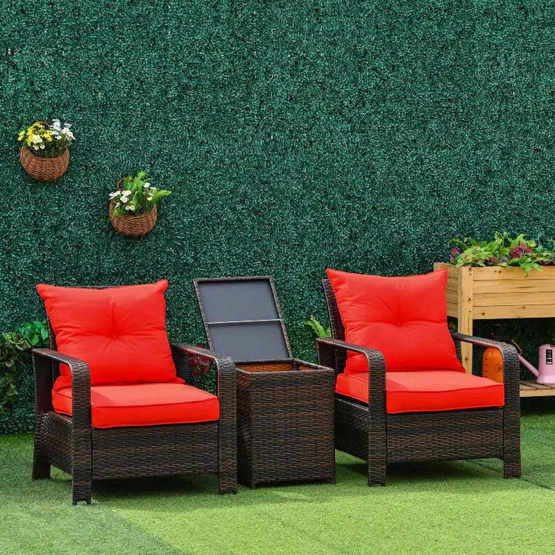 Wicker patio seating set with red cushions.