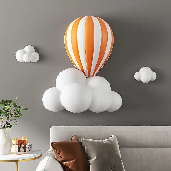 Wall-mounted hot air balloon and cloud decor.