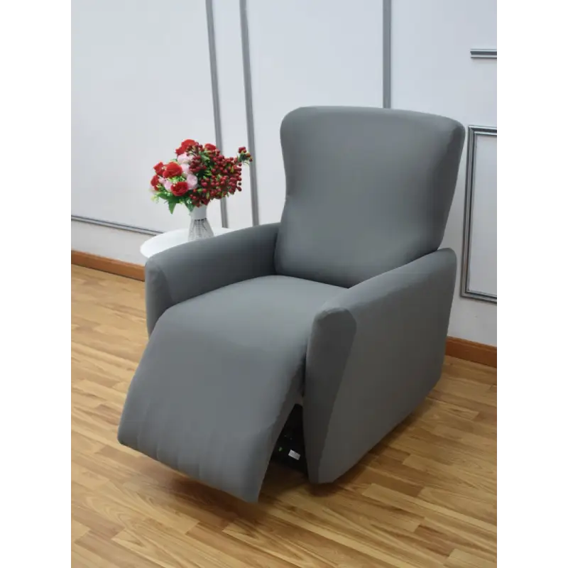 Gray recliner chair with extended footrest.
