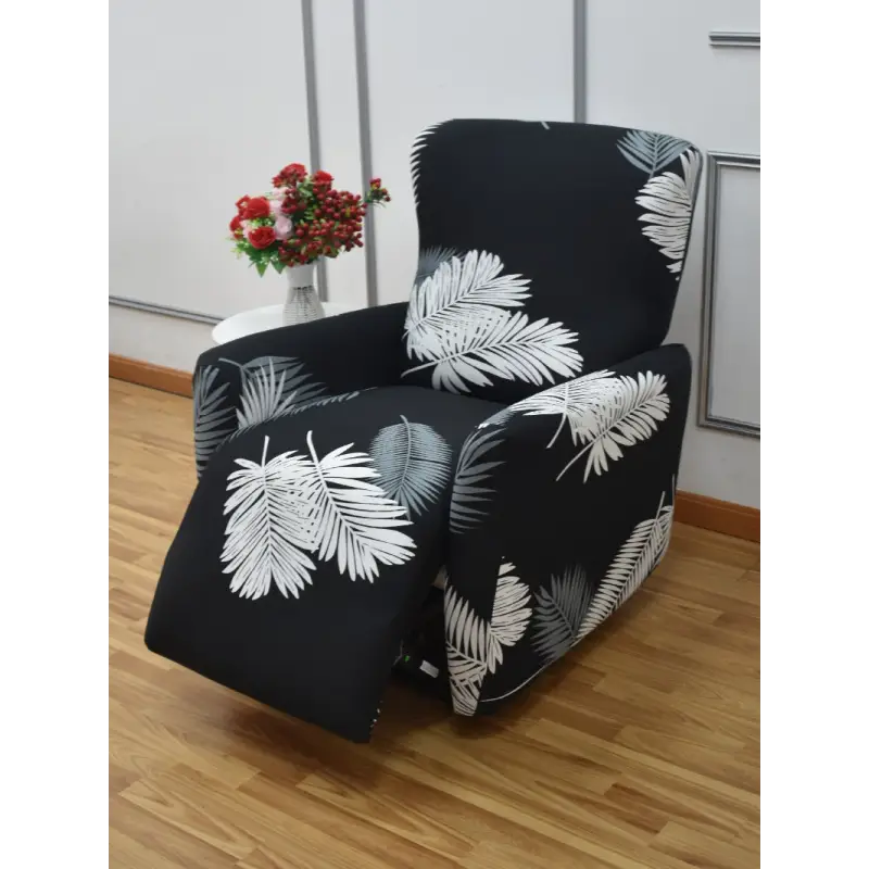 Black recliner slipcover with white leaf pattern.